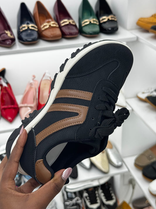Black sneaker with brown stripes