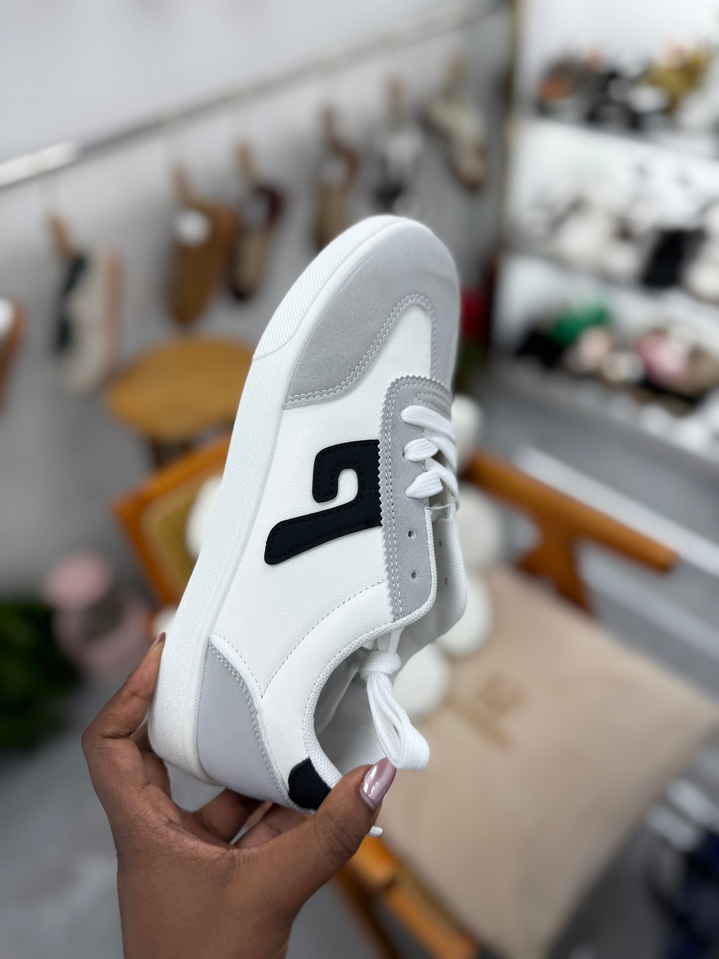 Grey and beige  sneaker with black stripe