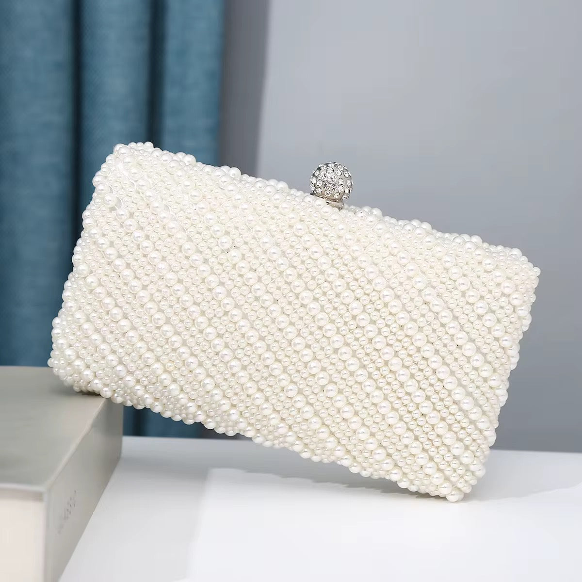 Kelly pearl clutch bag