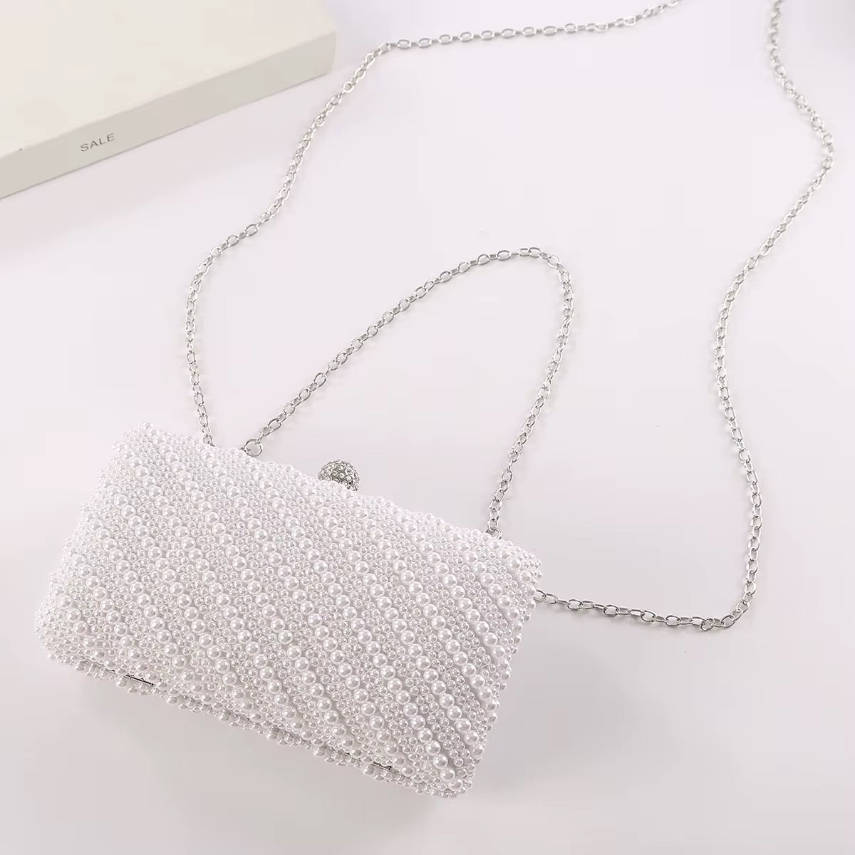 Kelly pearl clutch bag